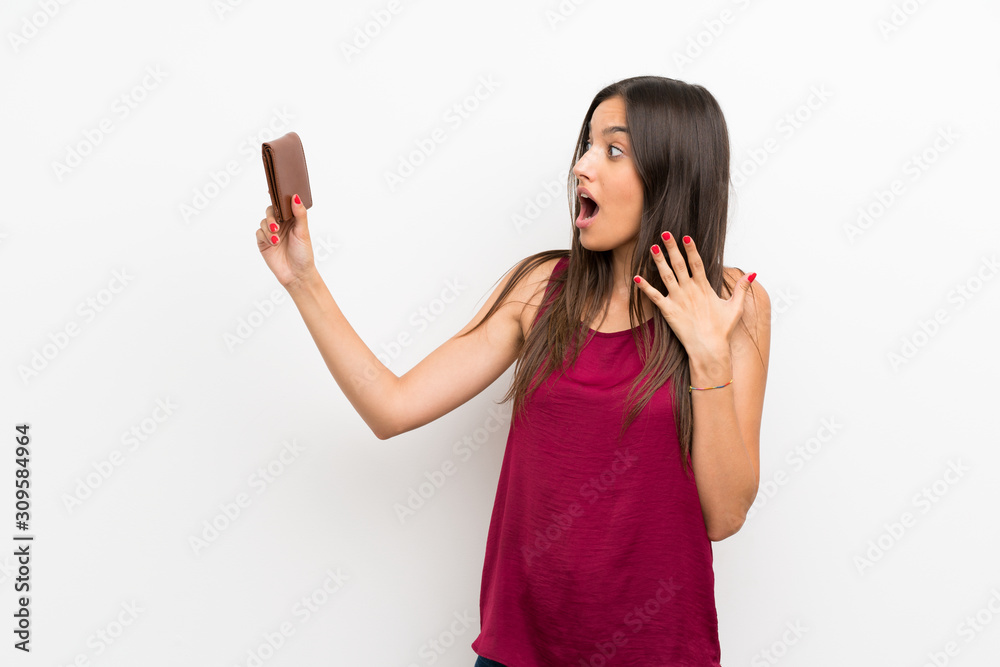 Young woman over isolated white background holding a wallet Young woman over isolated white background holding a wallet