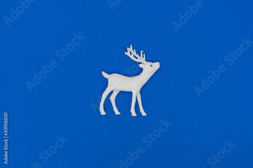 New Year and Christmas decorations. White deer. Top view  flat lay  copy space.