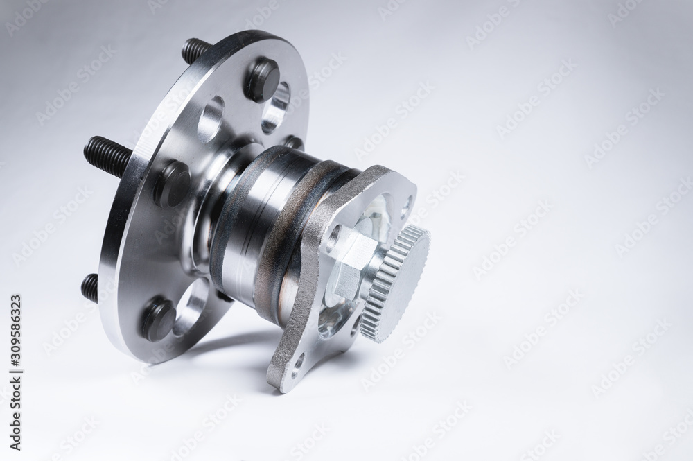 New Wheel hub assembly with bearing. This is part of the car suspension on a gray background with a gradient. The concept of new car parts New Wheel hub assembly with bearing. This is part of the car suspension on a gray background with a gradient. The concept of new car parts
