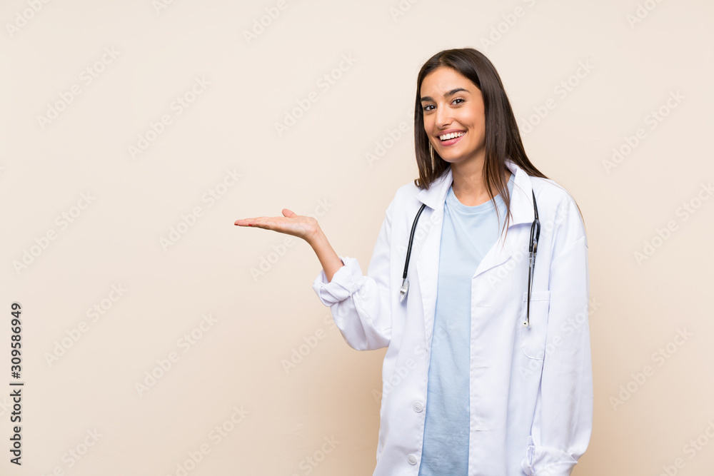 Young doctor woman over isolated background extending hands to the side for inviting to come Young doctor woman over isolated background extending hands to the side for inviting to come