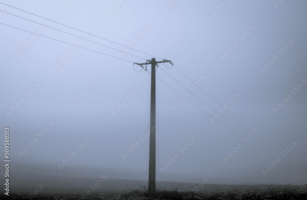isolated electric pole with mist