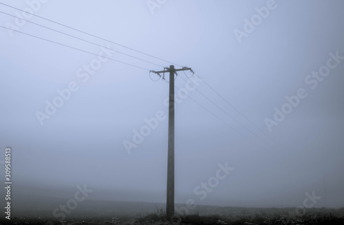isolated electric pole with mist