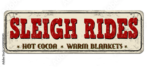 Sleigh rides vintage rusty metal sign