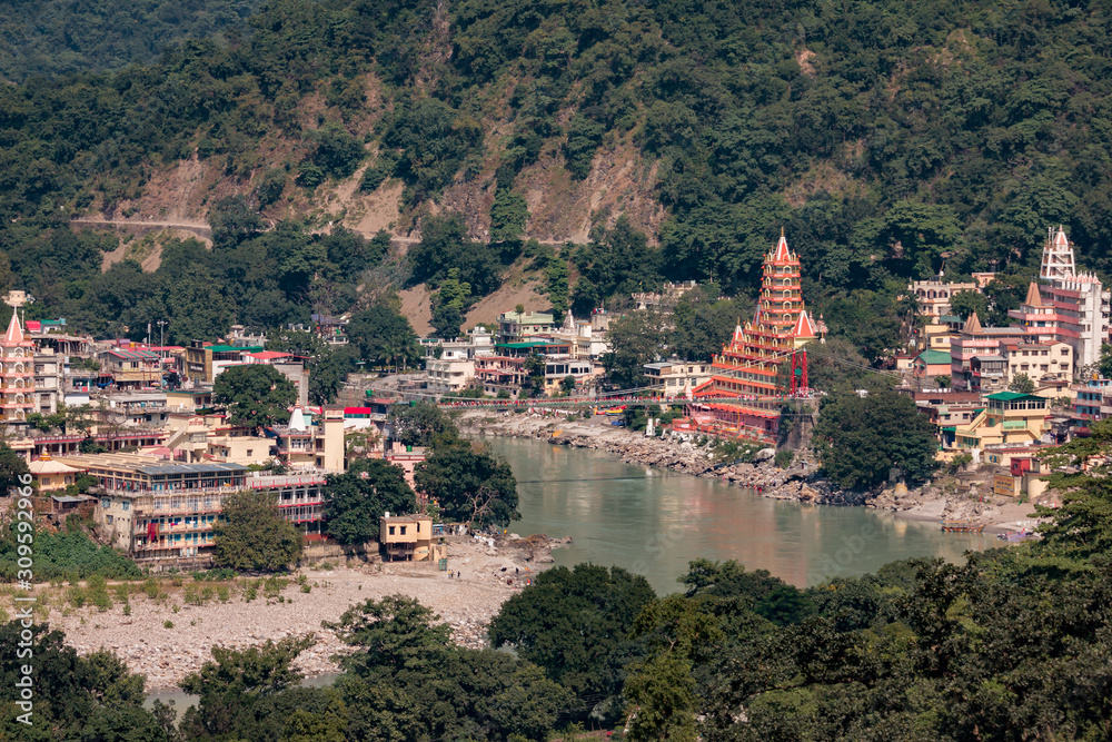 Aerial view of Rishikesh, temples and bridges, the Ganges Ganga River. Rishikesh, India.