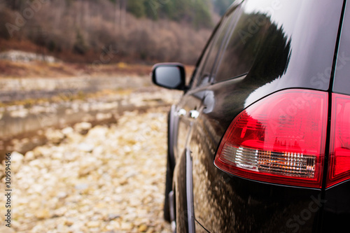 Off-road car on the stoned road in the mountains photo