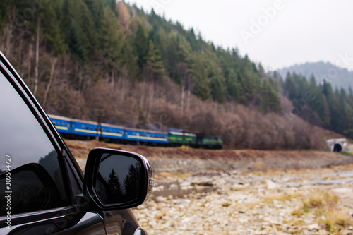 Train and sport car on speed © Valerii Dekhtiarenko