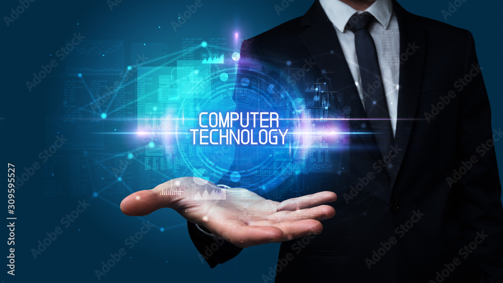 Man hand holding COMPUTER TECHNOLOGY inscription, technology concept Man hand holding COMPUTER TECHNOLOGY inscription, technology concept