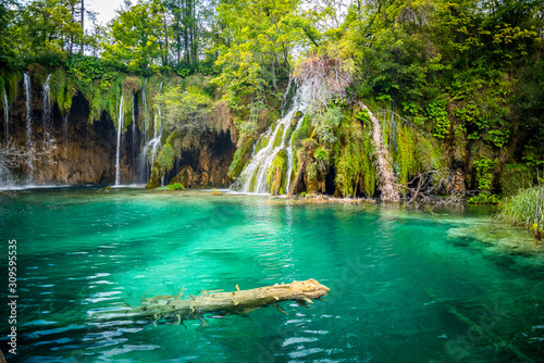 Amazing waterfalls with crystal clear water in the forest in Plitvice lakes National Park, Croatia. Nature landscape
