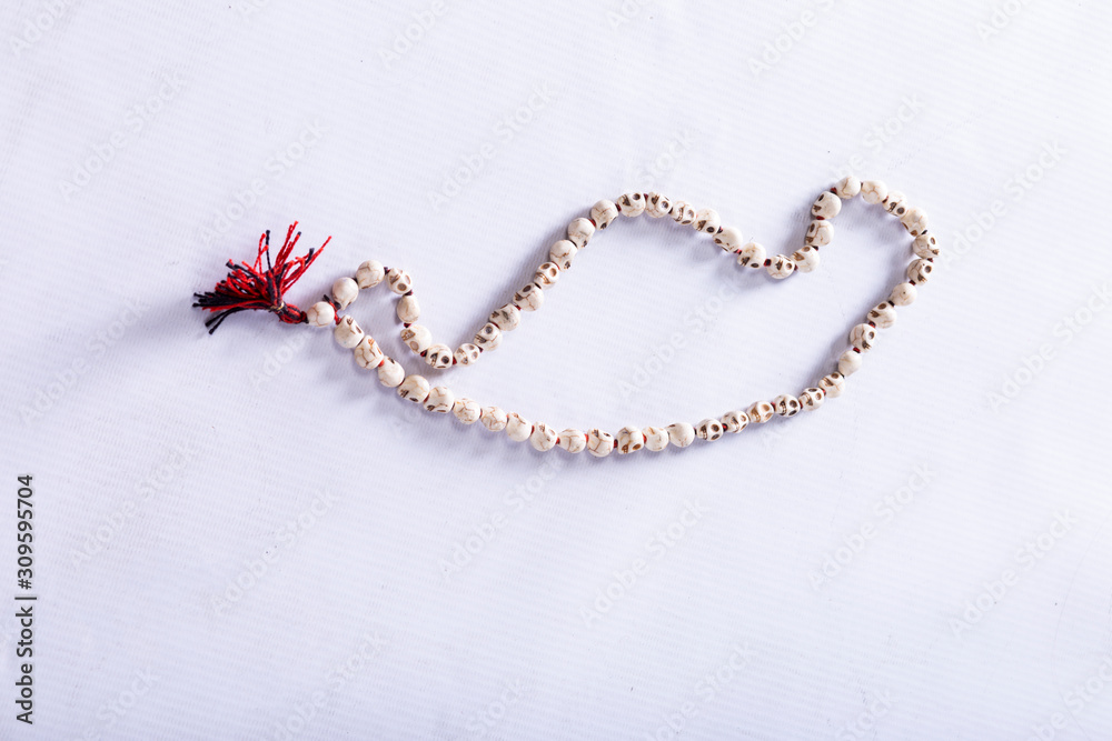 skull-shaped beads on a white background skull-shaped beads on a white background
