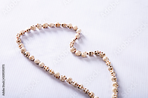 skull-shaped beads on a white background