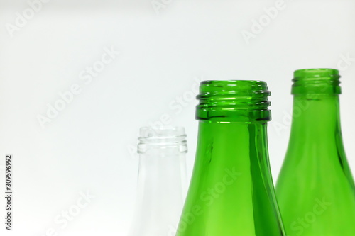 Green glass bottles in white background