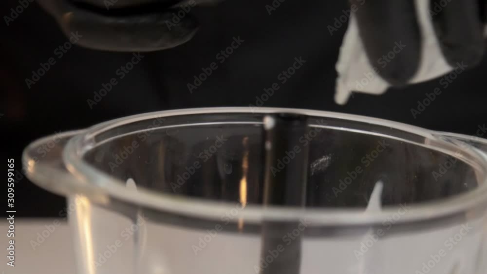 Adding homemade yogurt into glass food chopper Adding homemade yogurt into glass food chopper