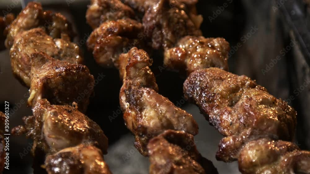 Skewered pork meat cooked on grill Skewered pork meat cooked on grill
