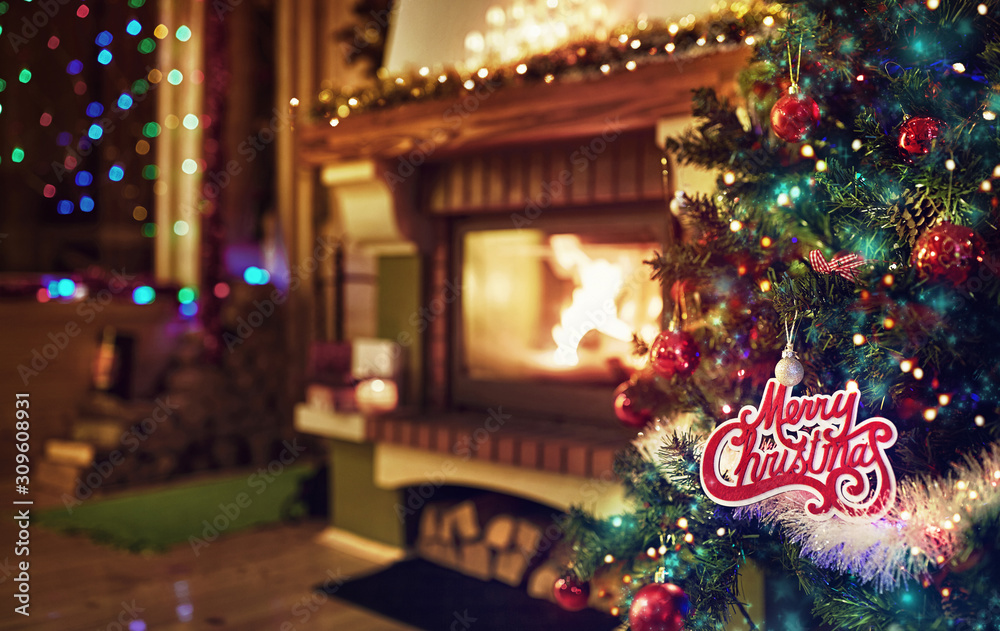 festive decor of a Christmas tree and a fireplace in background
