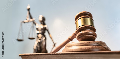 Statue of lady justice on bright background - Side view with copy space.