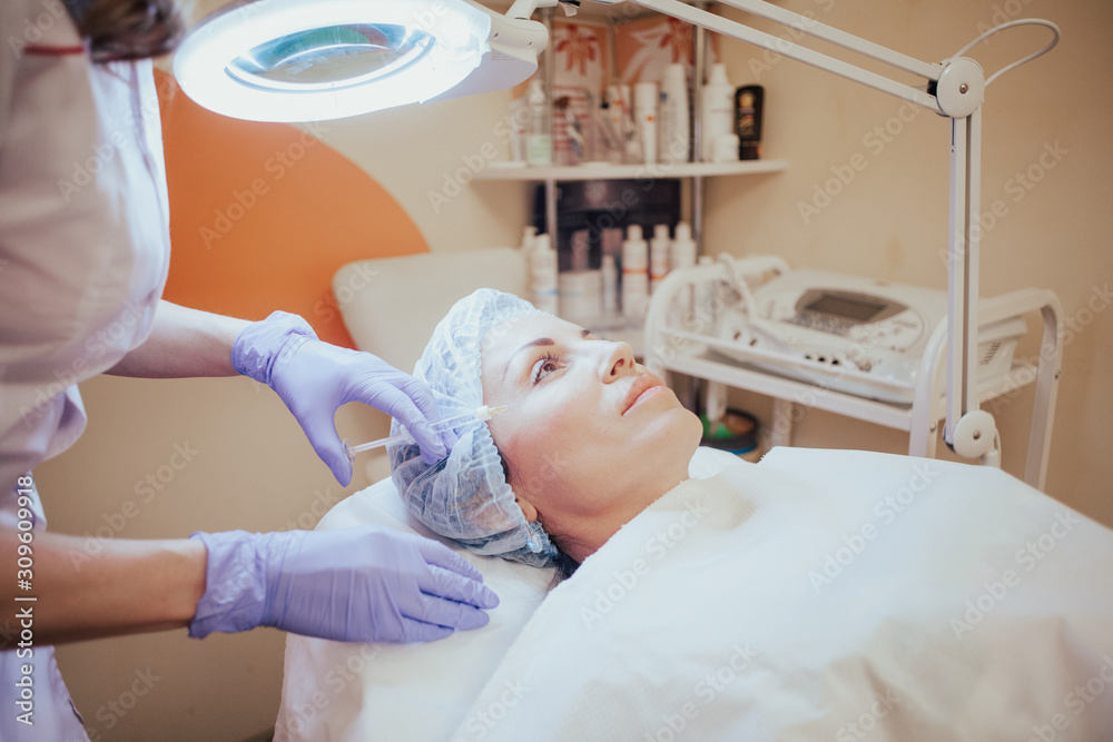 Cosmetology doctor makes injection in the lips Cosmetology doctor makes injection in the lips