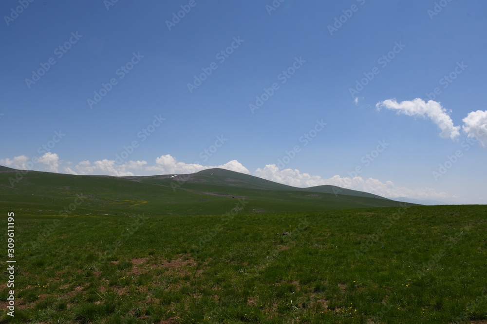 mountain landscape with blue sky and clouds