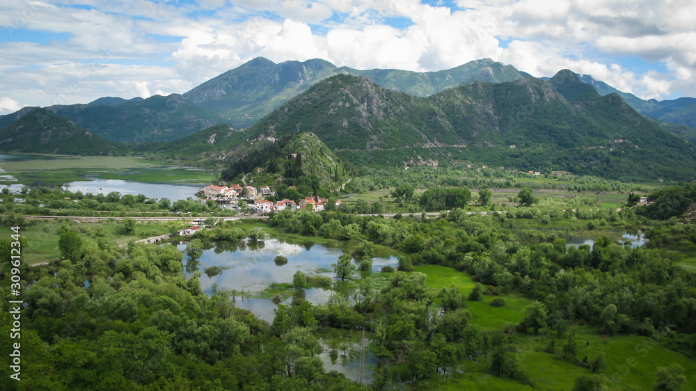 panoramic view from high place of Virpazar city near Skadar Lake and the forested mountains around