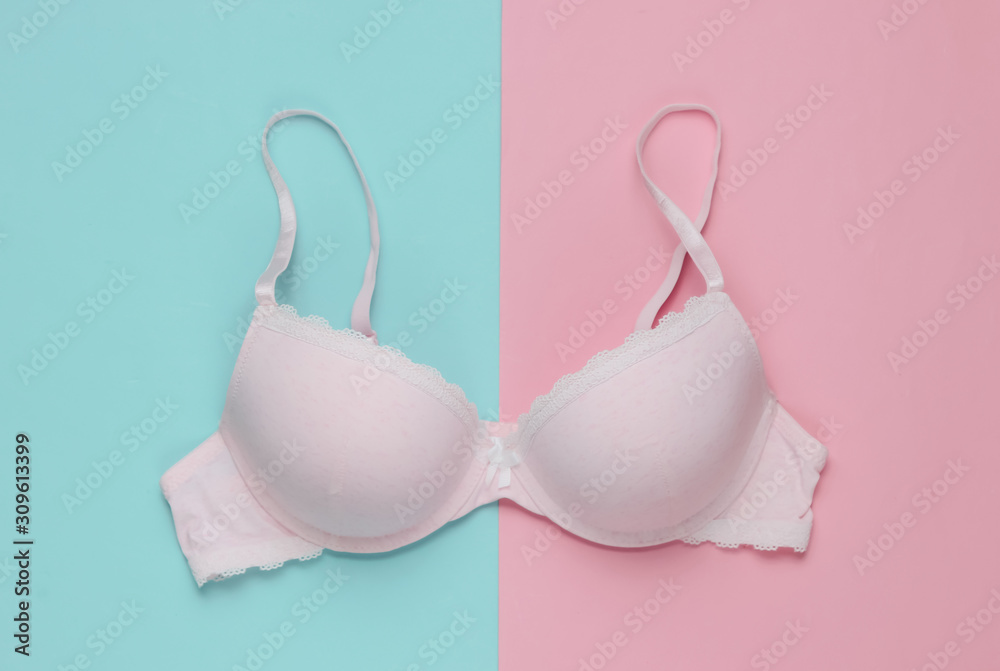 Stylish bra on pink blue background. Pastel color trend. Beauty and fashion  minimalistic still life Stock Photo