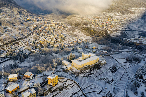 Valtellina (IT) - Panoramic view of the Convent of San Lorenzo with whitewashed landscape photo