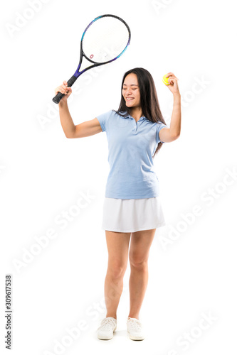 Young asian tennis player over isolated white background © luismolinero