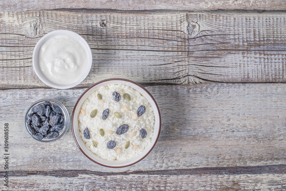 Сurd on a plate with raisin, honey, pumpkin seed. Healthy breakfast Cottage cheese Сurd on a plate with raisin, honey, pumpkin seed. Healthy breakfast Cottage cheese