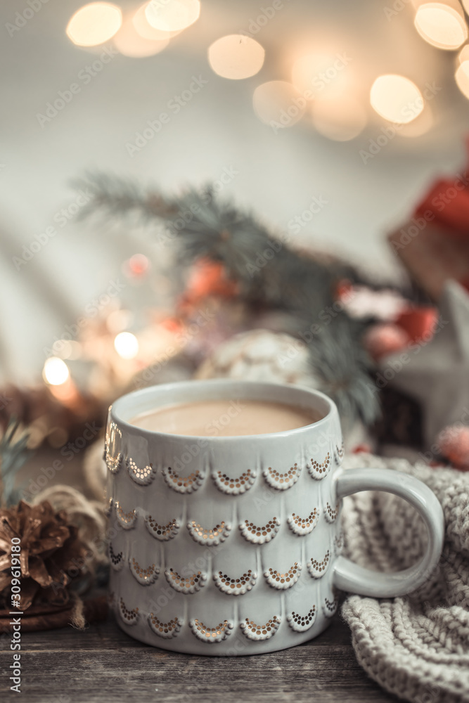 Festive background with Cup on wooden background with lights.
