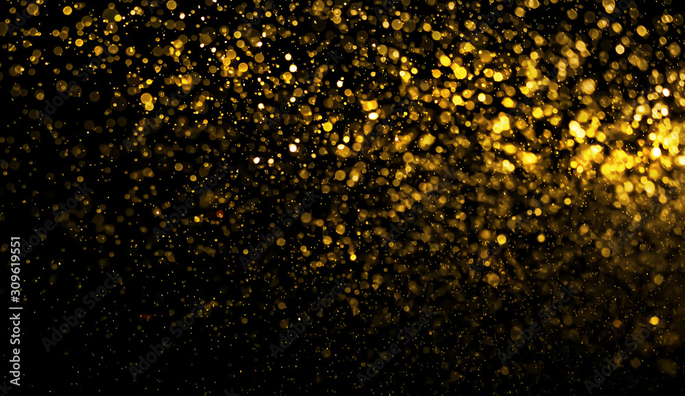 abstract golden bokeh light on black background