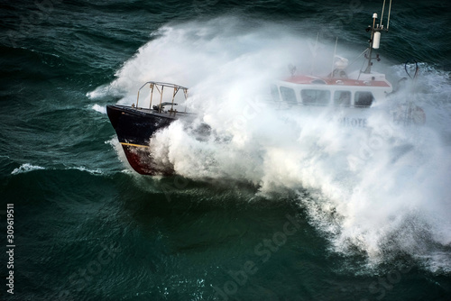 incredible view of a pilot boat in the storm photo