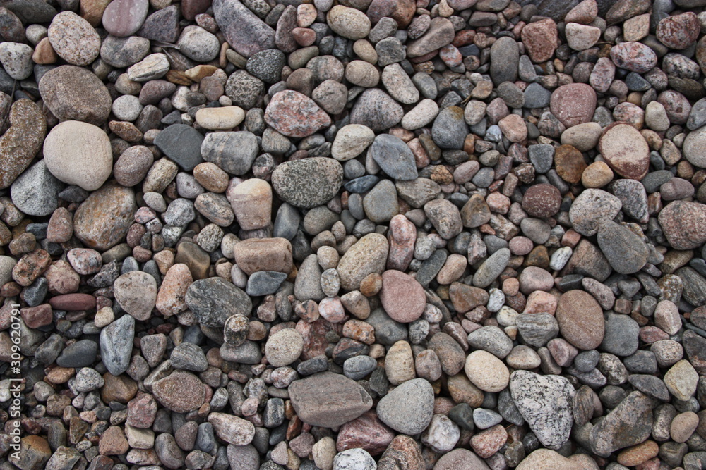 Background, texture with colorful pebbles in summer on the shore. Background, texture with colorful pebbles in summer on the shore.