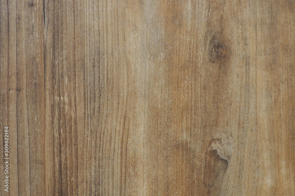 Obraz premium Closeup of wooden wall with texture and rough surface in warm brown tone for background and decoration.
