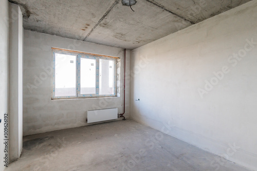 Russia, Omsk- August 05, 2019: interior room apartment. rough repair for self-finishing. interior decoration, bare walls of the room, stage of construction