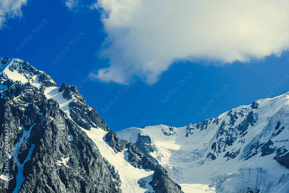 Rocky ridge under the snow. Mountain hiking, wilderness travel