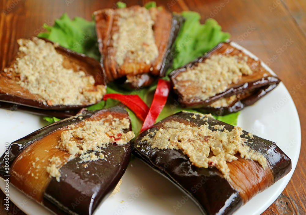 Plate of Georgian Eggplant Roll with Garlicky Ground Walnut Filling or Badrijani Nigvzit Plate of Georgian Eggplant Roll with Garlicky Ground Walnut Filling or Badrijani Nigvzit