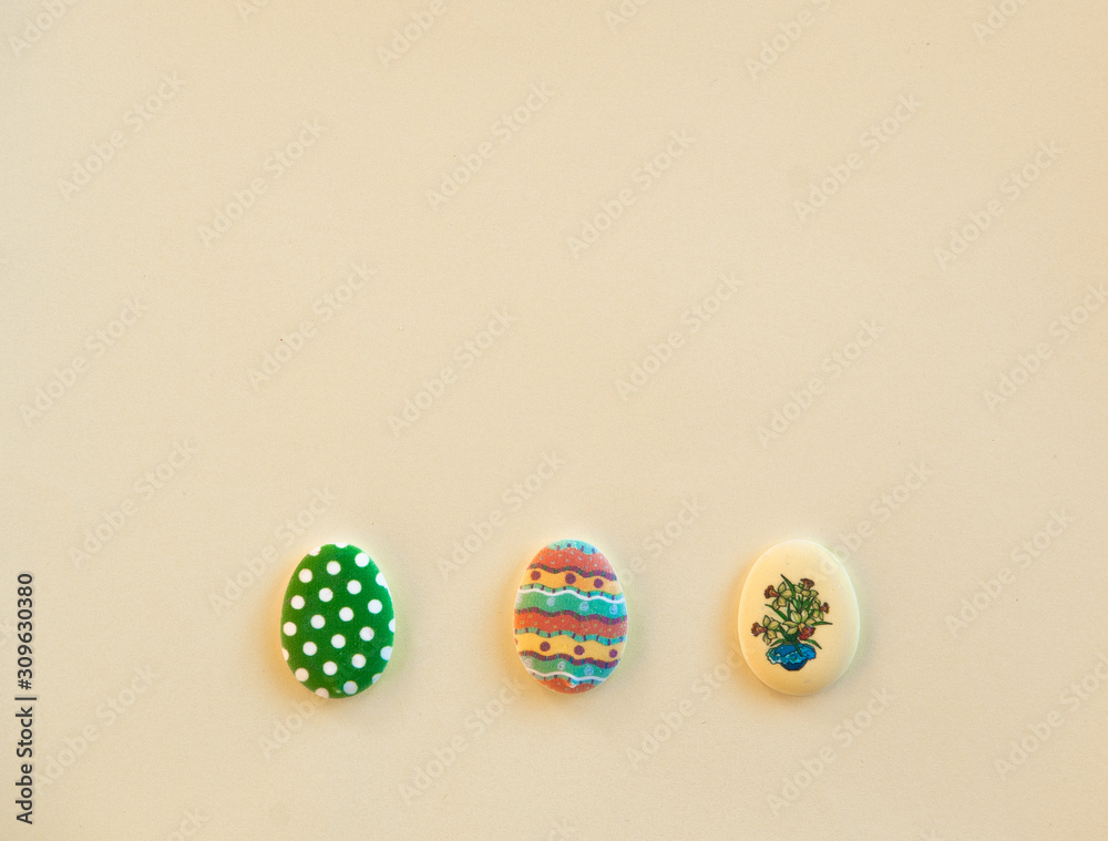 Easter background yellow with candy in the form of eggs Easter background yellow with candy in the form of eggs