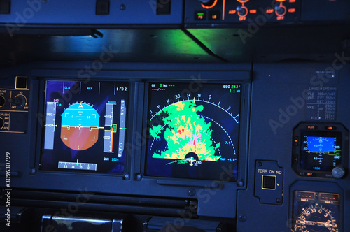 Fototapeta Naklejka Na Ścianę i Meble -  Close up shot on the weather radar on the Navigation Display screen of an Airbus, visible returns