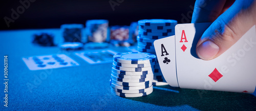 Man plays poker in the casino photo