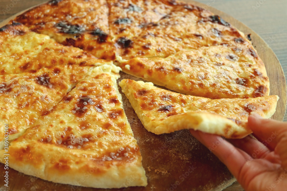Mouthwatering Fresh Baked Cheese-filled Georgian Flatbread Called Khachapuri Imeruli (Imeretian) Mouthwatering Fresh Baked Cheese-filled Georgian Flatbread Called Khachapuri Imeruli (Imeretian)
