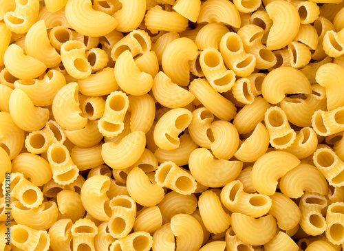 Raw pasta closeup, background. The view of top.