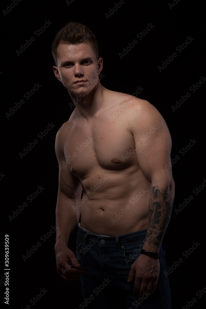 portrait of a beautiful strong young muscle man