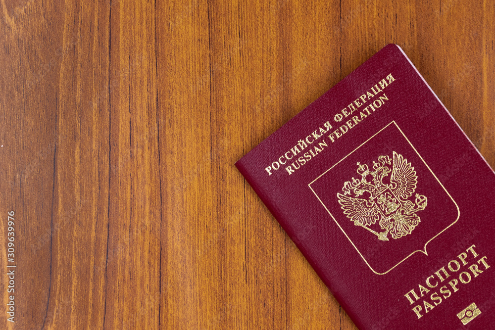 Russian passport on a wood background Russian passport on a wood background