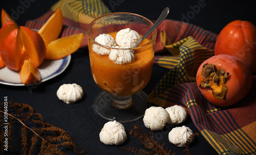 Dessert with persimmon fruit and meringue