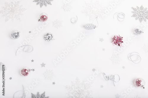 Christmas holiday composition. Festive creative gold silver pattern with ribbon on white background.