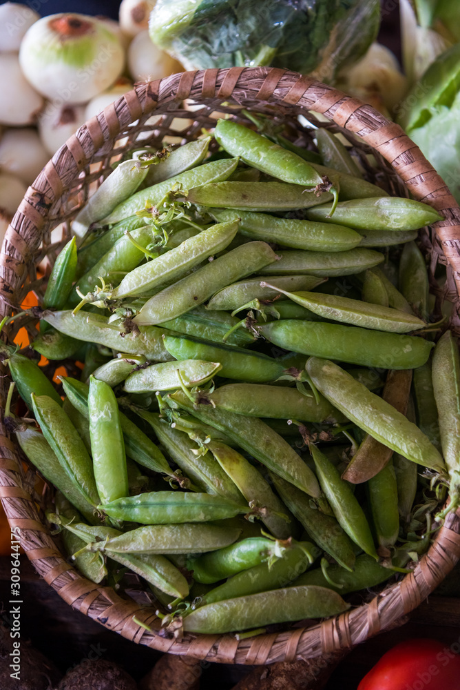 Peas in a basket for sale in an agricultural market in Colombia. Peas in a basket for sale in an agricultural market in Colombia.