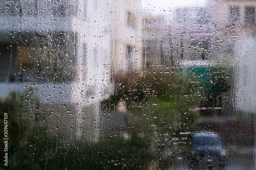Wet window glass with street view