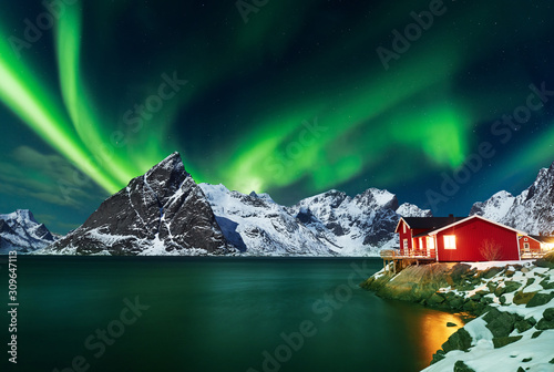 Aurora borealis over winter landscape - lofotens - Norway photo