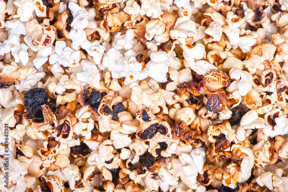 Background of burnt dark popcorn Background of burnt dark popcorn