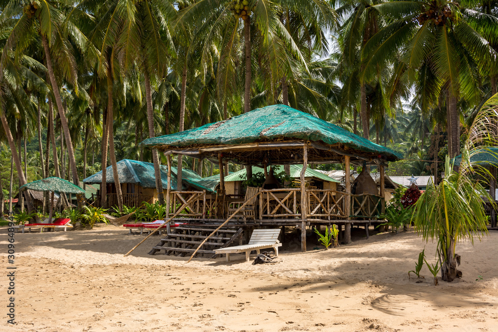 Shelter from the sun with sun loungers on the beach of El Nido Palawan Philippines