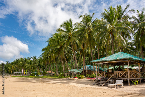 Shelter from the sun with sun loungers on the beach of El Nido Palawan Philippines