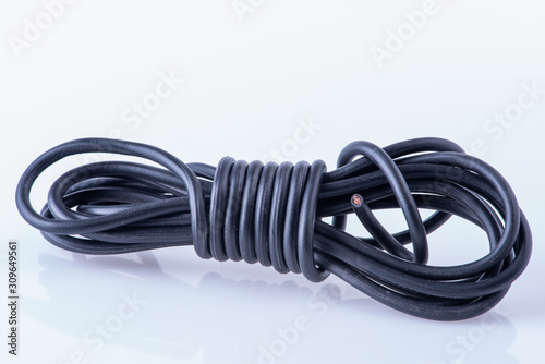 Electrical item rolled electric cable waste close-up